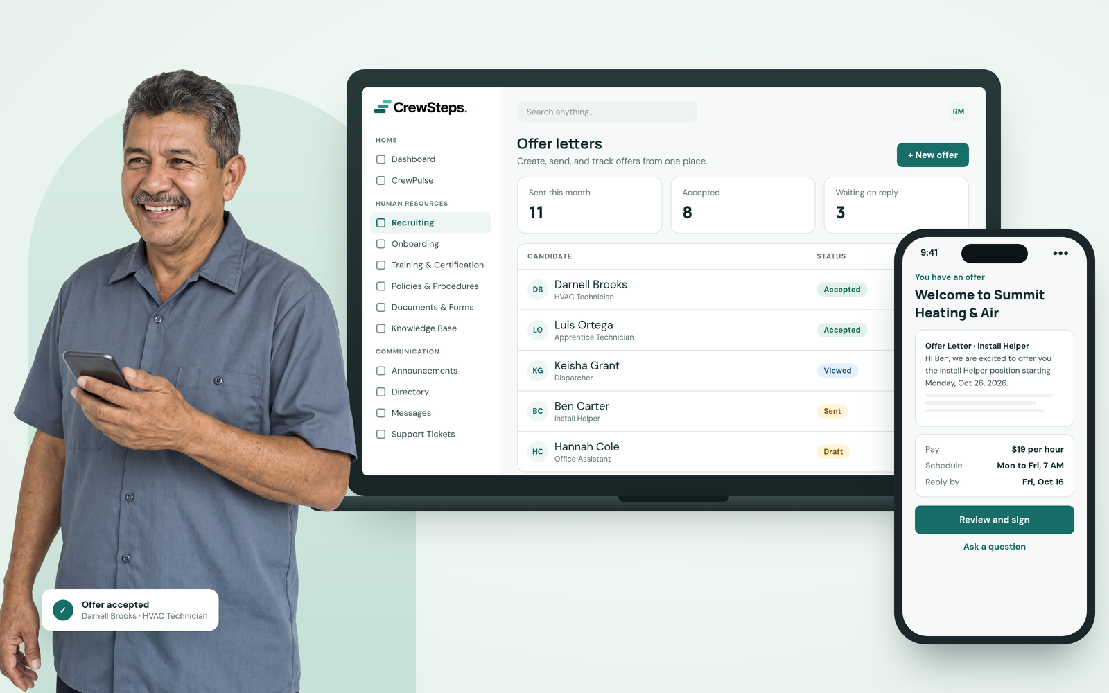 A smiling HVAC business owner holding his phone beside a CrewSteps laptop tracking offer letters and a phone where a new hire reviews his offer.